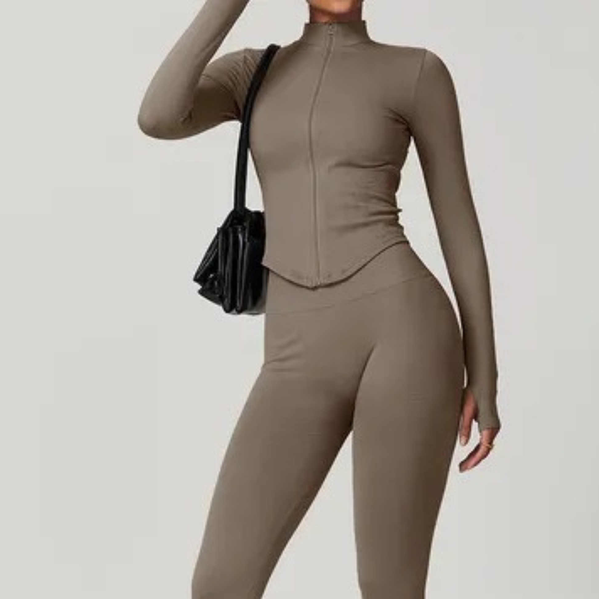 Beige women’s zip-up matching gym set – minimalist neutral-tone activewear with leggings and zip top for gym and athleisure