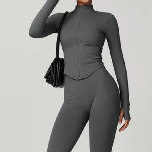Grey seamless women’s zip-up matching gym set – fitted activewear leggings and top by ELEV8HER